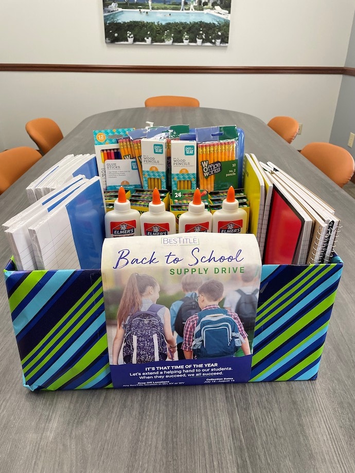 A box of schools supplies from BesTitle to support local schools.