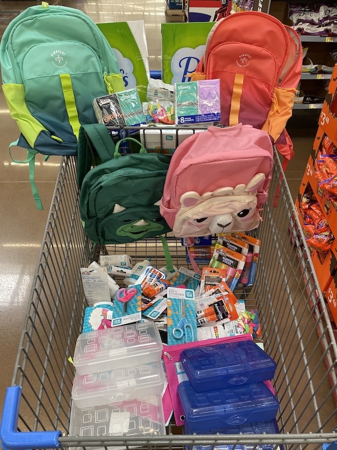 BesTitle supports local schools with a cart full of school supplies.