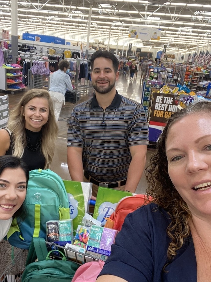 BesTitle employees supporting local schools by shopping for school supplies.